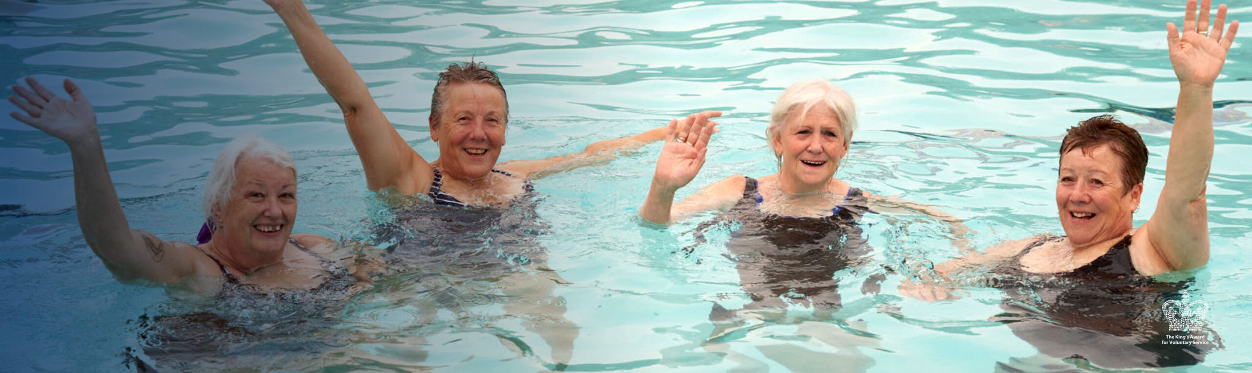 Four women swimming
