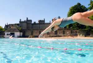 A woman diving into the pool